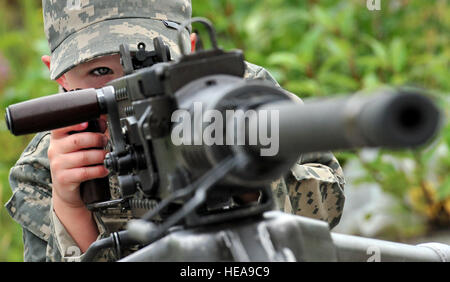 Brody Davis, 3, lines up the sights of a Browning M2HB .50-caliber heavy machine gun at a static weapons display during the Operation: Arctic Warrior event for children and families at the Joint Mobility Complex, Saturday, Aug. 13. Children and family members of service personnel experienced a mock deployment, static displays and enjoyed lunch during the event. Davis' father is Chief Warrant Officer 2 Robert Davis assigned to 98th Maintenance Company. Stock Photo