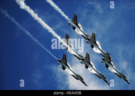 The U.S. Air Force Air Demonstration Squadron 'Thunderbirds,' perform the Delta Roll during the Joint Base Lewis-McChord Air Expo, July 21, 2012. Staff Sgt. Larry E. Reid Jr., Released) Stock Photo