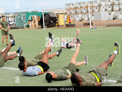 Army Sgt. Brian Pool, course instructor, leads physical training during the Joint Noncommissioned Officers Course, 3-14, Feb. 8, 2014. The Joint NCO Course was comprised of members from all four U.S. military branches, as well as two soldiers from the Djiboutian armed forces. While the curriculum of the joint course met all the requirements for the traditional Marine Corps Corporals Course, it also included lessons on how each service contributes to the joint team. It is designed to enhance leadership, mentorship, and confidence in NCOs.  Pool is team lead for Combined Joint Task Force-Horn of Stock Photo