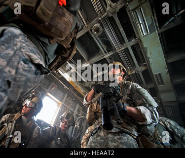 Members of the 2nd Battalion 138th Field Artillery Regiment disembark a CH-53E Super Stallion helicopter during a joint personnel recovery exercise in the Grand Bara Desert, Djibouti, Jan. 16. The exercise included two synchronized rescues - one on land and one at sea - and involved airmen, soldiers, sailors and Marines from Combined Joint Task Force-Horn of Africa as well as members of the French Foreign Legion. The exercise helped enhance joint and coalition interoperability and underscored the importance of personnel recovery in the Horn of Africa.  Tech Sgt. Joseph McKee) Stock Photo