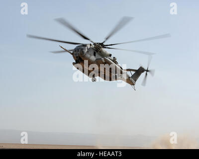 A U.S. Marine Corps CH-53E Super Stallion helicopter from HMH 464 Detachment A, Camp Lemonnier, Djibouti, descends after locating a simulated downed pilot during a joint personnel recovery exercise, Jan. 16 in the Grand Bara Desert. The exercise included two synchronized rescues - one on land and one at sea - and involved airmen, soldiers, sailors and Marines from Combined Joint Task Force-Horn of Africa as well as members of the French Foreign Legion. The exercise helped enhance interoperability and underscored the importance of personnel recovery in the Horn of Africa.  Staff Sgt. Caleb Pier Stock Photo