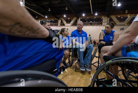 Mark Shepherd, Air Force Wounded Warrior coach, talks to his basketball team during the 2015 Trials on Nellis Air Force Base, Nev., March 1, 2015. The Air Force Trials are an adaptive sports event designed to promote the mental and physical well-being of seriously ill and injured military members and veterans. More than 105 wounded, ill or injured service men and women from around the country will compete for a spot on the 2015 U.S. Air Force Wounded Warrior Team which will represent the Air Force at adaptive sports competitions throughout the year.  Senior Airman Jordan Castelan Stock Photo