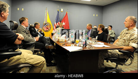 Army Maj. Gen. William Roy, commander, Joint Task Force Civil Support, discusses the increased capabilities and changes of the command as it has evolved over the past 15 years with former JTF-CS commanders here Oct. 1, 2014. JTF-CS held a celebration to recognize accomplishments of the unit since its inception in 1999. JTF-CS anticipates, plans, and prepares for CBRN defense support to civil authorities response operations. (Official DOD  Air Force Tech. Sgt. Gwendolyn Blakley) Stock Photo