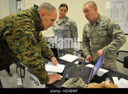 Marine Corps Col. David Olszowy, Joint Task Force Civil Support deputy commander, checks the file management system of the aerial port of debarkation team during the command post exercise Sudden Response 15 here Dec. 5. Sudden Response 15 tests JTF-CS’ procedures and collaborative efforts in response to the initial phases of a simulated man-made or natural disaster. JTF-CS anticipates, plans and prepares for chemical, biological and nuclear defense support to civil authorities response operations. (Official DOD  Air Force Airman 1st Class Yvonne Morales) Stock Photo