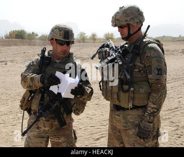 U.S. Army Staff Sgt. Bruce Harrington left, Kandahar Provincial ...