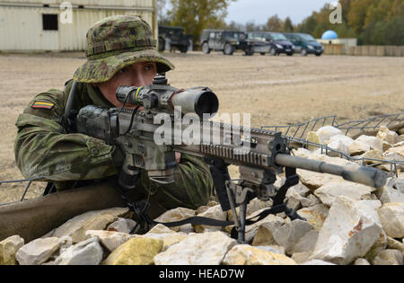 A Lithuanian soldier pulls security for his team during the Call for Fire event as part of the European Best Sniper Squad Competition at the 7th Army Training Command's Grafenwoehr training area Germany, Oct. 24, 2016. The European Best Sniper Squad Competition is an Army Europe competition challenging militaries from across Europe to compete and enhance teamwork with Allies and partner nations.  Spc. Sara Stalvey) Stock Photo