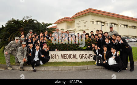 Dental students and 18th Dental Squadron personnel gather at Kadena Air Base, Japan, for an educational tour highlighting differences in Japanese, American, and military dental practices. Stock Photo