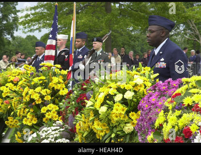 MARGRATEN, Netherlands -- Air Force Master Sgt. Michael Coonce (right) stands ready to direct wreath bearers during the Memorial Day ceremony at the Netherlands American Cemetery here.  The cemetery is the final resting place for more than 8,300 Americans who died during World War II.  Coonce was the noncommissioned offer in charge of ceremonies and is assigned to the Regional Headquarters Allied Forces North Europe Air Force Element.   Tech. Sgt. Rob Mims) Stock Photo