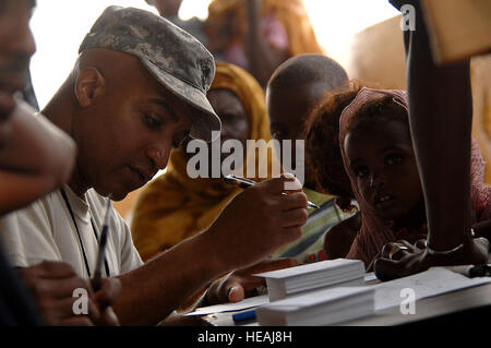 Instructor 1st Sgt. Archie Smith from the 354th Civil Affairs (CA) Brigade, Special Functioning Team, Combined Joint Task Force- Horn of Africa, signs in patients to be seen during a Medical Civil Action Project (MEDCAP) on March 29, 2008 at Goubetto Village, Djibouti. The 354th is conducting a six day MEDCAP around the Djibouti area with their first two days at Goubetto Village seeing over 500 local Djiboutian patients by the end of day two. Stock Photo