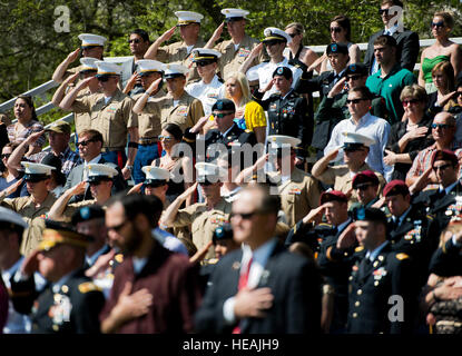 Army and Marine explosive ordnance disposal technicians salute during the 45th Annual EOD Memorial Ceremony May 3, at Eglin Air Force Base, Fla. Eight new names of Army and Marine EOD technicians, who lost their lives, were added to the wall this year.  The all-service total now stands at 306. Tech. Sgt. Sam King) Stock Photo