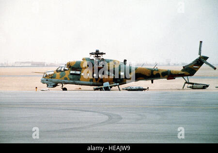 A captured Iraqi MIL Mi-24 Hind helicopter stands at an XVIII      Airborne Corps airfield  during Operation Desert Storm. Stock Photo