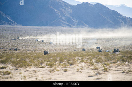 A group of amphibious assault vehicles from 3rd Amphibian Assault Battalion, 1st Marine Division move to their next designated position while participating in a mechanized assault course during Integrated Training Exercise 2-16 at Marine Corps Air Ground Combat Center, Twentynine Palms, Calif., Jan. 28, 2016. MCAGCC conducts relevant live-fire combined arms, urban operations, and joint/coalition level integration training that promote operational forces' readiness.  Senior Airman Steven A. Ortiz Stock Photo