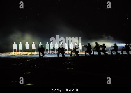 U.S. Marines with Maritime Raid Force, 13th Marine Expeditionary Unit, conduct a deck shoot at night during their Western Pacific Deployment 16 aboard the USS New Orleans, April 1, 2016. More then 4,500 Marines and Sailors from the Boxer ARG, 13th MEU team are currently transiting the Pacific Ocean toward the U.S. 5th fleet area of operations during a scheduled deployment.  Sgt. Hector de Jesus/) Stock Photo