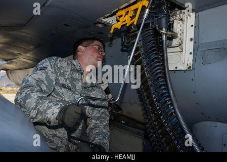 U.S. Air Force Airman 1st Class Austin Holden, a weapons load crew member assigned to the 480th Expeditionary Fighter Squadron, Spangdahlem Air Base, Germany, uses a universal ammunition loading system to load 20 mm practice rounds into an F-16 Fighting Falcon fighter aircraft during a flying training deployment on the flightline at Souda Bay, Greece, Jan. 29, 2016.The inert munitions used during the FTD simulate real conditions the 480th EFS pilots might use when engaging enemy forces.  Staff Sgt. Christopher Ruano Stock Photo