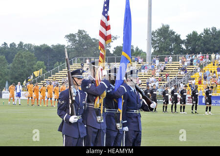 Combined 437th and 315th Airlift Wing honor guard members post the colors at the beginning of the Charleston Battery soccer game during the first of two military appreciation nights at Blackbaud Stadium June 25. The Charleston Battery professional soccer team traditionally holds two military appreciation nights during the year with the first one being in June and the second one in September. Staff Sgt. Marie Cassetty)() Stock Photo