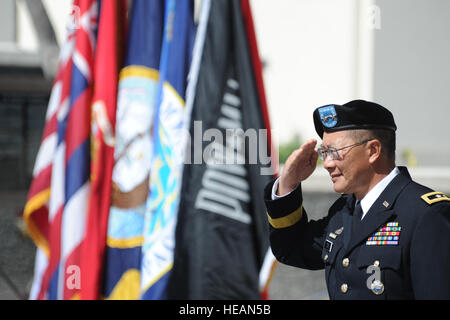 HONOLULU, Hawaii – U.S. Army Maj. Gen. Stephen D. Tom, the Commander of the Joint POW/MIA Accounting Command (JPAC) salutes during the playing of the National Anthem at the start of the National POW/MIA Recognition Day Ceremony held at the National Memorial Cemetery of the Pacific (Punchbowl) in Honolulu, Hawaii on Sept. 16. More than 200 past and present military members gathered with civilians to celebrate the day, which recognizes the sacrifices of those Americans who have been prisoners of war and to remind the Nation of those individuals that are still missing. JPAC is responsible for the Stock Photo