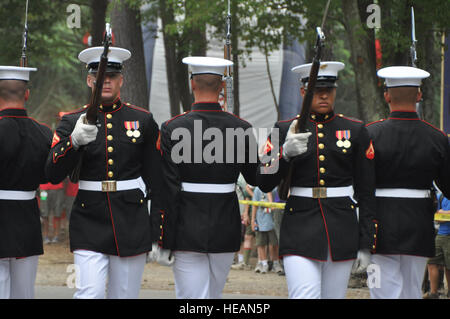 The U.S. Marine Corps Silent Drill Platoon performs a 15-minute choreographed drill July 29 at the 2010 National Scout Jamboree on Fort A.P. Hill, Va. The team was a part of several attractions made available by the Joint Task Force-National Scout Jamboree to entertain Scouts and visitors at the event. The JTF-NSJ's goal is to provide professional military support and a safe and secure environment for Scouts and visitors during the event. Stock Photo