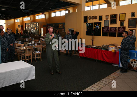 160921-N-DC740-014 OAK HARBOR, Wash. (Sept. 21, 2016) – Capt. Geoff Moore, Naval Air Station Whidbey Island commanding officer, speaks during a special meal commemorating the base's 74th anniversary. 'We've had 74 years, and I expect us to have at least 74 more,' said Moore. 'This base continues to be an important part of our national capabilities.' NASWI was duly commissioned when Capt. Cyril Thomas Simard read the orders on the steps of Building 12 and the watch was set, Sept. 21, 1942. This photo has been altered for security purposes.  Mass Communication Specialist 2nd Class John Hethering Stock Photo