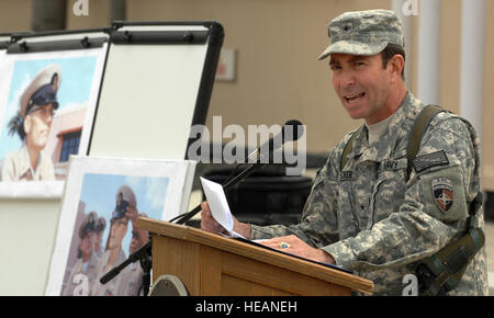 Rear Adm. Paul Becker, attached to International Security Assistance Force Joint Command, addresses assembled service members during a ceremony celebrating the 117th birthday of the US Navy Chief Petty Officers, on Camp Eggers. During the birthday celebration, a tribute was held to honor Petty Officer 1st Class David Eberhart, shown at left, who was named an honorary Chief by then MCPON Joe Campa, days before losing a battle with cancer. Camp Eggers is the headquarters of NATO Training Mission - Afghanistan, which is responsible for training and equipping the Afghan National Army and Police.   Stock Photo