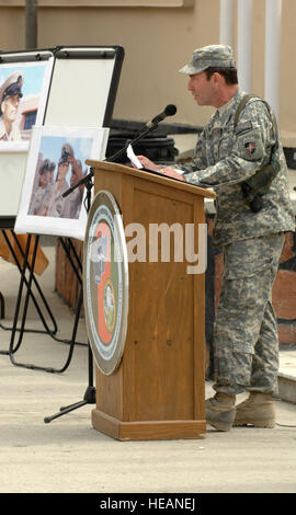 Rear Adm. Paul Becker, attached to International Security Assistance Force Joint Command, addresses assembled service members during a ceremony celebrating the 117th birthday of the US Navy Chief Petty Officers, on Camp Eggers. During the birthday celebration, a tribute was held to honor Petty Officer 1st Class David Eberhart, shown left, who was named an honorary Chief by then MCPON Joe Campa, days before losing a battle with cancer. Camp Eggers is the headquarters of NATO Training Mission - Afghanistan, which is responsible for training and equipping the Afghan national army and police.  Sta Stock Photo