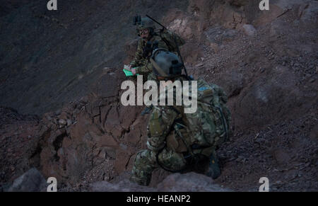 Joint tactical air controllers from Detachment 1, 82nd Expeditionary Rescue Squadron, perform range calculations and control fire during a live-fire training exercise with the 303rd Expeditionary Rescue Squadron at the Arta range, Djibouti, June 22, 2015. The 303rd ERQS conducts training events working with enabling units to maintain proficiency while deployed in support of humanitarian aid and contingency operations in the Combined Joint Task Force Horn of Africa area of responsibility. ( Staff Sgt. Gregory Brook Stock Photo