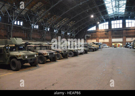 BUFFALO, NY-- New York Army National Guard vehicles lined up ready to be used to aid civil authorities at the Masten Avenue Armory here on Wednesday, June 8, following a snow storm which hit the Buffalo area on June 7 at the same time intense cold affected the northeastern United States. The New York National Guard mobilized more than 260 Army and Air National Guard service members to be prepared to help at the direction of New York Governor Andrew Cuomo (U.S. National Guard  Senior Master Sgt. Raymond Lloyd, 107th Airlift Wing/ Released) Stock Photo