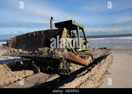 Soldiers from the 150th and 160th Engineer Companies, New Jersey Army National Guard, employed D7 bulldozers to perform beach replenishment operations Nov. 8, 2012, in the devastated Holgate section of Long Beach Island, N.J., following Hurricane Sandy and Nor'easter Athena.  More than 2,000 soldiers and airmen from the New Jersey National Guard have been mobilized in response to Hurricane Sandy.   Master Sgt. Mark C. Olsen Stock Photo