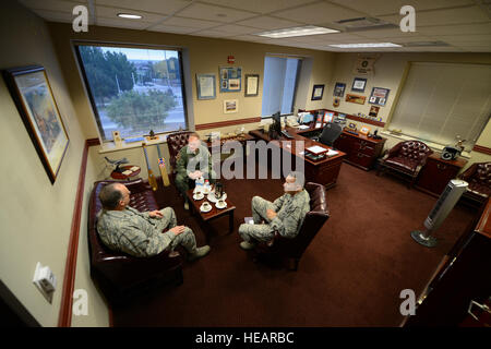 From left, Brig. Gen. (Dr.) Lee E. Payne, Air Force Medical Operations Agency commander, Col. Darrell Judy, 47th Flying Training Wing vice commander, and Col. Mike Patronis, 47th Medical Group commander, conduct an office call on Laughlin Air Force Base, Texas, Oct. 15, 2015. Laughlin Air Force Base hosted the commander of AFMOA to provide an in-depth look into its mission and to offer an opportunity to interact with the Airmen of the 47th Medical Group Oct. 14-15.  Tech. Sgt. Steven R. Doty)(Released) Stock Photo