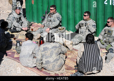 U.S. Soldiers with Bear Troop, 8th Squadron, 1st Cavalry Regiment meet with Afghan border policemen at a checkpoint in Spin Boldak, Afghanistan, Jan. 9. The mission of the Afghan border police is to secure the borders of Afghanistan from infiltration and illegal entry of persons and the smuggling of contraband. : Tech Sgt. Francisco V. Govea II) Stock Photo