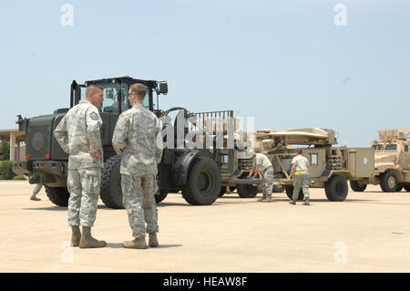 Senior Master Sgt. Frank Graziano, 20th Logistics Readiness Squadron superintendent of deployment and distribution and a native of Fowler, Ohio, supervises the loading of equipment on to a Russian Antonov An-124 Ruslan at Shaw Air Force Base, S.C., June 30, 2012. Airmen from 20th LRS loaded three mine-resistant ambush-protected vehicles, two satellite communication devices and additional supplies on to the plane for 8th Army in the Republic of Korea.  Airman 1st Class Krystal Jeffers Stock Photo