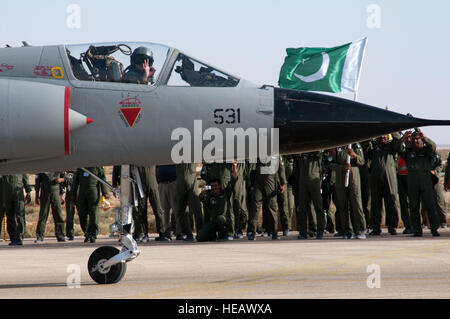 A Pakistan air force pilot in a Mirage aircraft gives a hand signal during the Falcon Air Meet 2010 alert scramble competition at Azraq Royal Jordanian Air Base, Jordan, Oct. 20, 2010. The United States, Jordan and Pakistan participated in the Falcon Air Meet to improve international military relations and joint air operations.  Tech. Sgt. Wolfram M. Stumpf Stock Photo