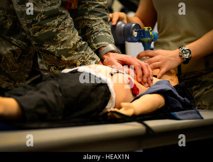 Pediatric Advanced Life Support training students practice pediatric cardiopulmonary resuscitation, July 8, 2015, at Aviano Air Base, Italy. The course trains health care professionals to provide quality care for seriously ill or injured children.  Senior Airman Areca T. Wilson Stock Photo