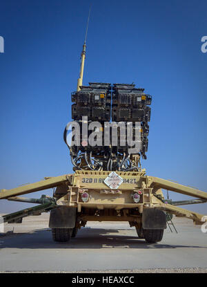 A Patriot Missile Weapon System managed by soldiers from the 3-43 Air Defense Artillery Battalion who are deployed from Fort Bliss, Texas., faces the blue sky at Al Udeid Air Base, Qatar, Jan. 22, 2014. The Patriot is the Army's primary surface-to-air missile system and also functions as an anti-ballistic missile system, which protects the base from air and missile attacks. The Patriot is the only anti-ballistic missile system to have successfully engaged and destroyed a tactical ballistic missile in combat. (U.S /Senior Airman Jared Trimarchi) Stock Photo