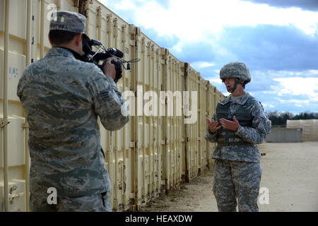 U.S. Army Maj. Gen. Janet Cobb, Assistant Deputy Chief of Staff, G4, gets interviewed by Senior Amn. Daniel Montoya, videographer, 4th Combat Camera Squadron, March Air Reserve base, Calif. during exercise Patriot Warrior at Ft. McCoy, Wisconsin, May 3, 2014. United States reserve components from all branches participate in combined joint exercises Patriot Warrior, Global Medic, Diamond Saber, and CSTX in preparation for upcoming deployments in joint environments.  Technical Sgt. Dan St. Pierre Stock Photo