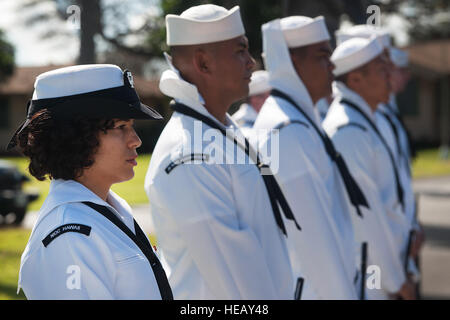 U.S. Navy Petty Officer 3rd Class Sarah Meadows and other sailors of the Regional Pacific Color Guard, prepare to participate in an interment ceremony in honor of Quartermaster 2nd Class Theodore F. Roosevelt at the USS Utah Memorial March 20, 2014, at Ford Island, Hawaii. Roosevelt, a distant relative of former U.S. Presidents Theodore Roosevelt and Franklin Roosevelt, was born April 24, 1924 in West Allis, Wis., and joined the Navy shortly after his 17th birthday. It was Roosevelt's wish to have his remains brought back to Hawaii so he could be reunited with his shipmates who lost their live Stock Photo