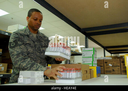 Tech. Sgt. Robert Little, 332nd Expeditionary Medical Support Squadron medical logistician, stocks shelves with blood testing tubes here, March 10. The medical supply room is full of commonly used medical items to save space and specialty items can be ordered and received within seven days from Germany. Sergeant Little is deployed from Lackland Air Force Base, Texas. Stock Photo