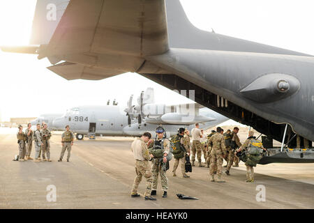 U.S. Air Force pararescuemen, 82nd Expeditionary Rescue Squadron (ERQS), prepare to board an MC-130P Combat Shadow, 81st ERQS, in preparation for a training mission over the Gulf of Tadjoura, Djibouti, March 21, 2013. The squadrons regularly conduct missions in support of Combined Joint Task Force-Horn of Africa.  Staff Sgt. Devin Doskey Stock Photo