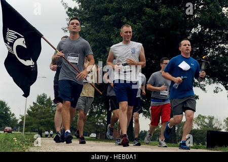 Members of Team Whiteman participate in the annual Prisoners of War/Missing in Action run at Whiteman Air Force Base, Mo., Sept.18, 2014. Approximately 1,500 Airmen from various conflicts are missing from Air Force ranks.  Airman 1st Class Jovan Banks Stock Photo