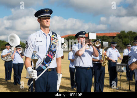 Master Sgt. Steven Erickson, Air Force Band drum major, stands at attention while the Band of the West plays before the 502nd Air Base Wing and Joint Base San Antonio change of command ceremony at JBSA-Fort Sam Houston’s MacArthur Parade Field Aug. 5, 2016. Airmen assigned to the band are highly-trained professional musicians who have dedicated themselves to serving their country through music. Stock Photo