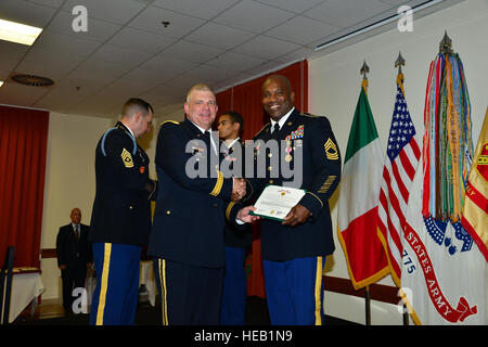 Master Sgt. Warren Jones II, assigned to U.S. Army Africa received the meritorious service medal, presented by Brig. Gen. Kenneth Moore, U.S. Army Africa Deputy Commander, during Quarterly Retirement Ceremony, June 9, 2016 held at the Golden Lion on Caserma Ederle in Vicenza, Italy.  Visual Information Specialist Antonio Bedin/released) Stock Photo