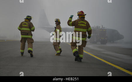 A group of firefighter runs toward the scene of a simulated aircraft crash during a major accident response exercise on Ramstein Air Base, Germany, Oct. 18, 2014. Members of the U.S. Air Force and host nation agencies partnered in conducting a response and recovery exercise in preparation for possible real-world incidents. Senior Airman Hailey Haux)