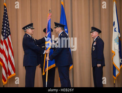 Gen. Robin Rand accepts the Air Force Global Strike Command flag from Air Force Chief of Staff Gen. Mark A. Welsh III during a change of command ceremony at Barksdale Air Force Base, La., July 28, 2015. The Air Force elevated AFGSC to a four-star major command to provide its global strike missions with the highest level of leadership oversight similar to the service’s other core operational missions. AFGSC develops and provides combat ready forces for safe, secure, and effective nuclear deterrence and conventional global strike operations to support the President of the United States and comba Stock Photo