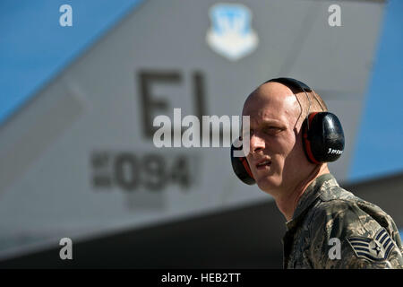 U.S. Air Force Staff Sgt. Joshua Simmons, 28th Aircraft Maintenance Squadron aircraft electrical and environmental journeyman, Ellsworth Air Force Base, S.D., waits for a B-1B Lancer to depart for a training mission during Red Flag 12-2 Jan. 24, 2011, at Nellis Air Force Base, Nev. Red Flag is a realistic combat training exercise involving the air forces of the United States and its allies. The exercise is hosted north of Las Vegas on the Nevada Test and Training Range. Stock Photo