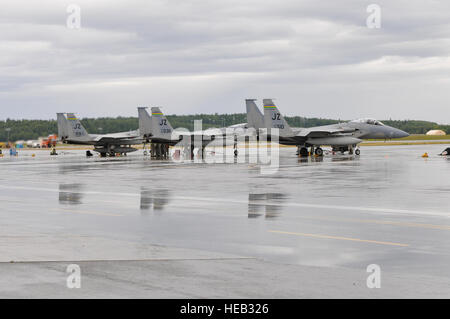 USAF F-15s from Kadena Air Base, Okinawa, Japan, and Naval Air Station Joint Base New Orleans and British C-130s from 47th Squadron Royal Air Force, stage out of Joint Base Elmendorf-Richardson, Anchorage, Alaska, participating in Red Flag 11-3. Stock Photo