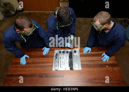 Airmen apprentices from the 361st Training Squadron practice applying sealant to aircraft fuel system trainers at Sheppard Air Force Base, Texas, on September 7, 2016, to prevent leaks in integral fuel tanks as part of the aircraft fuel systems apprentice course. Stock Photo