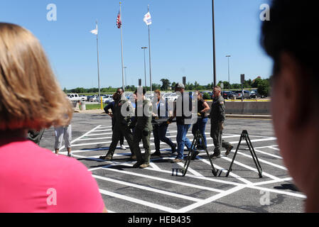 375th Aeromedical Evacuation Squadron members teach Department of Veteran Affairs personnel how to properly conduct a 6-person litter carry during training  June 7, 2016 at the MidAmerica St. Louis Airport in Mascoutah, Illinois. DVA civilians learned how to get a littered patient on and off a simulated aircraft, which helped familiarize them with military equipment.   Staff Sgt. Maria Bowman) Stock Photo