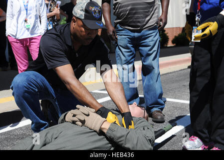 Joseph Randolph, Department of Veterans Affairs surgical nurse, secures a 'patient' during training June 7, 2016 at the MidAmerica St. Louis Airport in Mascoutah, Illinois. Patients must be secured to the litter before transporting them to another location.   Staff Sgt. Maria Bowman) Stock Photo