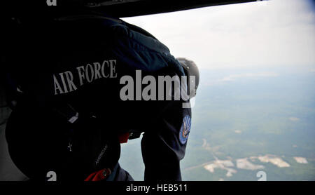 Cadet Jesse Galt, a member of the U.S. Air Force Academy Wings of Blue Jump Team, prepares to jump from a U.S. Army UH-60 Black Hawk helicopter July 27. The Wings of Blue Parachute Team operates as the 98th Flying Training Squadron at the U.S. Air Force Academy in Colorado Springs, Colo., and performed in support of the Boy Scouts of America's 2010 National Scout Jamboree. Stock Photo