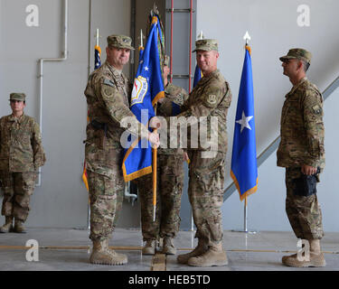 U.S. Air Force Maj. Gen. Scott West, 9th Air and Space Expeditionary Task Force-Afghanistan commander, relieves Brig. Gen. Mark Kelly from command during a change of command ceremony July 1, 2015, at Bagram Air Field, Afghanistan. Kelly relinquished command to the new commander Brig. Gen. Dave Julazadeh.  Senior Airman Cierra Presentado Stock Photo