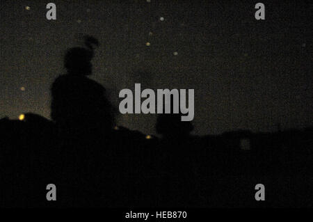 U.S. Army Soldiers from Alpha Troop, 6th Squadron, 9th Armored Reconnaissance Regiment, 3rd Brigade Combat Team, 1st Cavalry Division provide security through the night in Shakarat, Iraq on March 22. Alpha Troop Soldiers conduct patrols and build an Army combat outpost in Shakarat.   Staff Sgt. Stacy L. Pearsall) Stock Photo